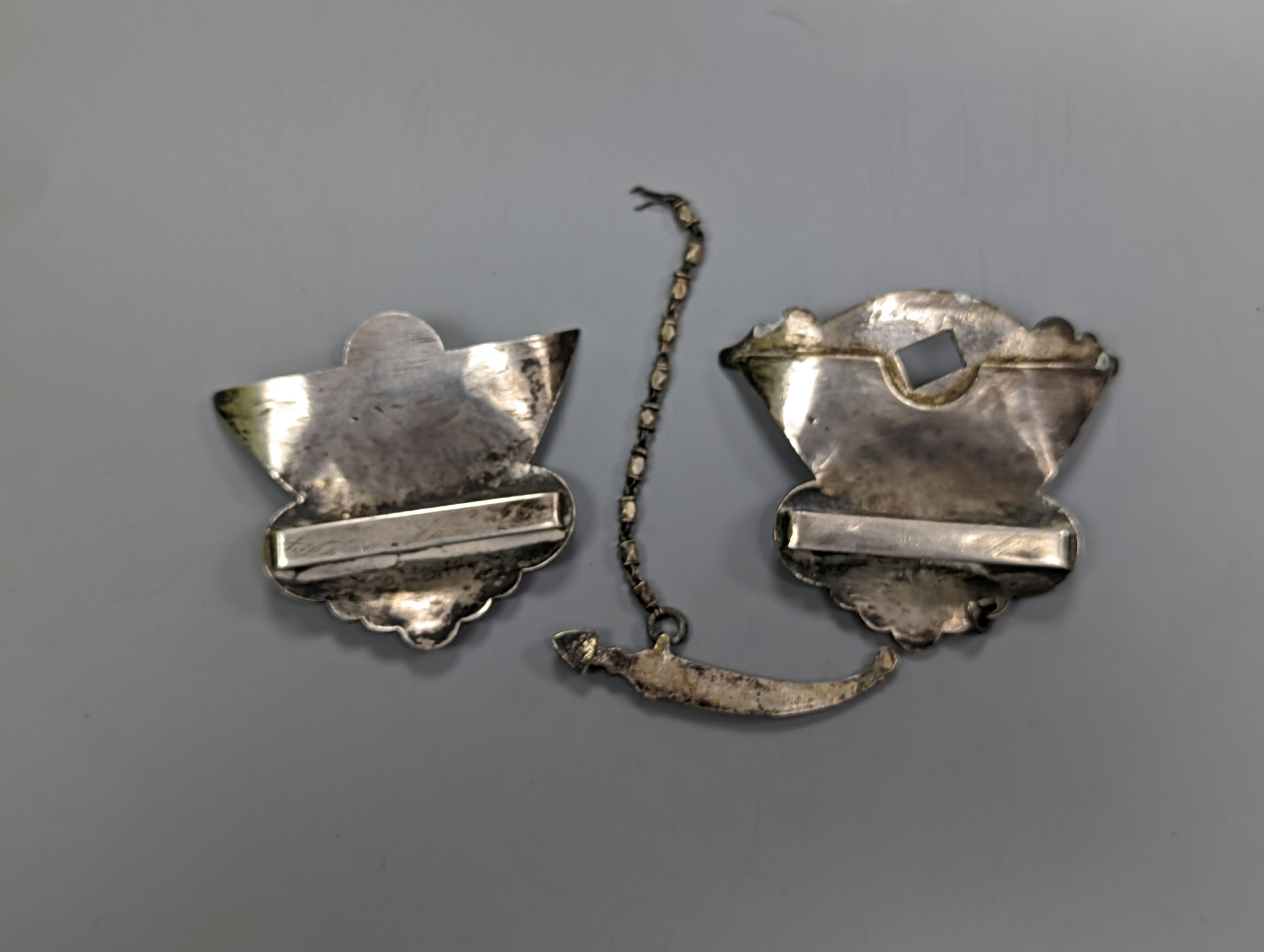 A 19th century Persian white metal and niello belt buckle, 9cm. wide